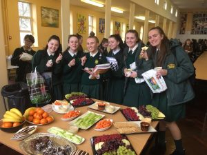Students enjoying healthy snacks in the hall.