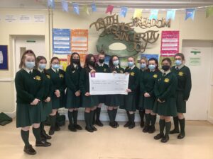 TY & LCVP students with a cheque for Women's Aid